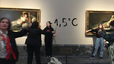 Two Workers Cling To The Frames Of The Paintings Of Las Mazas De Goya In The Prado Museum